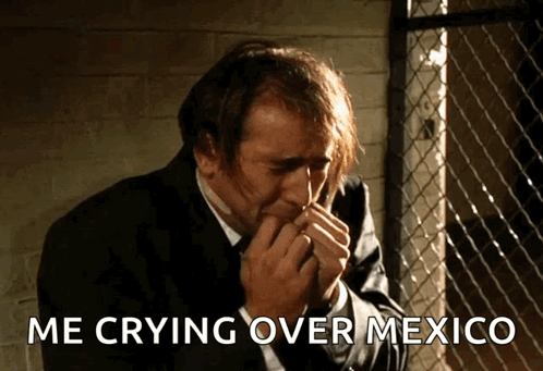 Man in Suit Crying Over Mexico Covering Mouth
