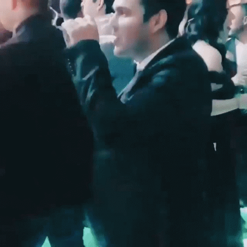 Man in Suit Dancing at Party