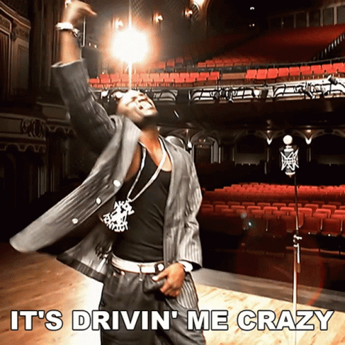 Man In Suit Dancing Behind Microphone GIF