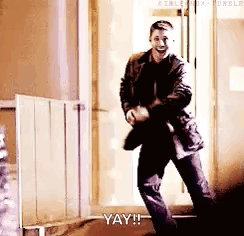Man in Suit Dancing in Doorway Saying Yay
