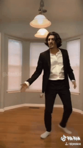 Man in Suit Dancing in Empty Room TikTok