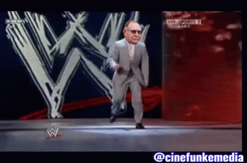 Man in Suit Dancing in Front of W Logo