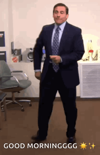 Man in Suit Dancing in Office