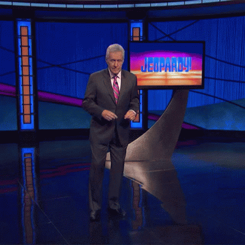Man In Suit Dancing On Jeopardy Stage GIF