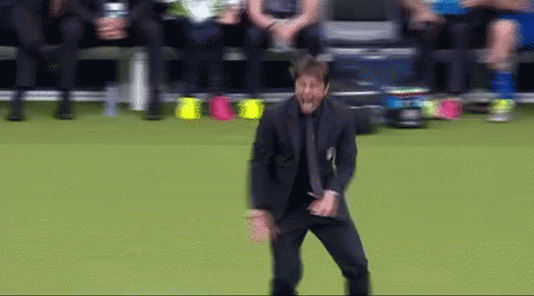 Man In Suit Dancing On Soccer Field GIF