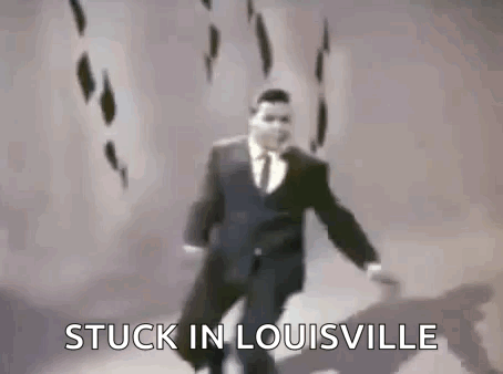 Man in Suit Dancing Stuck in Louisville