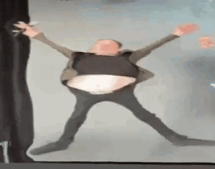 Man in Suit Dancing with Big Belly