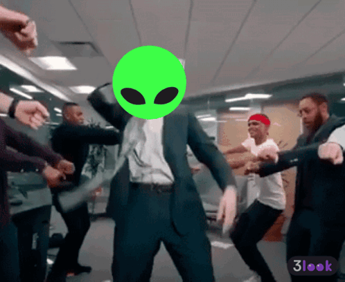 Man in Suit Dancing with Green Alien Head
