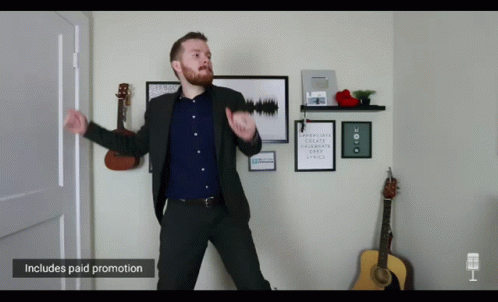 Man in Suit Dancing With Paid Promotion Sign