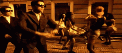 Man In Suit Dancing With Woman In White Dress GIF