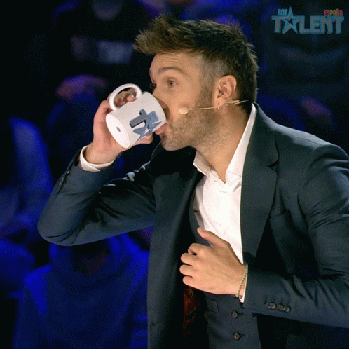 Man in Suit Drinking Espana Talent Mug