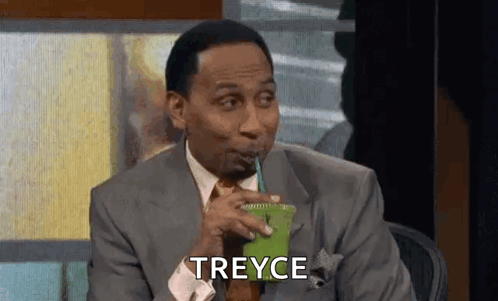 Man in Suit Drinking Green Smoothie Saying Treyce