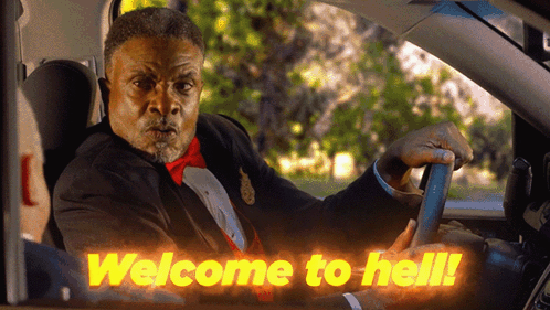 Man in Suit Driving 'Welcome to Hell' Car