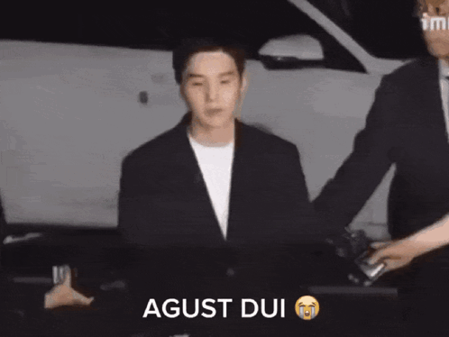 Man In Suit Escorted Saying Agust Dui GIF