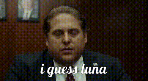 Man in Suit Eyes Closed Saying I Guess Luna