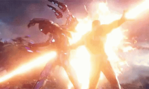 Man in Suit Fighting in Front of Explosion