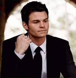 Man In Suit Fixing Tie GIF