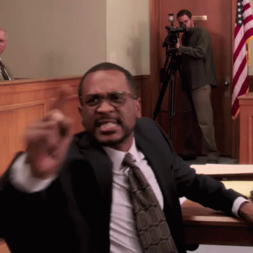 Man in Suit Giving Courtroom Speech