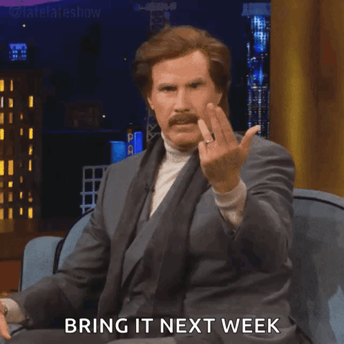 Man In Suit Giving Middle Finger Saying Bring It Next Week GIF