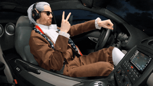 Man In Suit Giving Peace Sign GIF