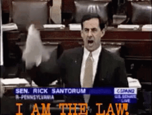 Man in Suit Giving Speech in Congress Says I Am the Law