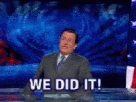 Man in Suit Giving Speech Saying We Did It
