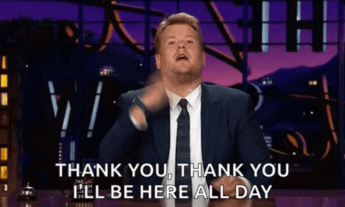 Man in Suit Giving Thank You Gesture
