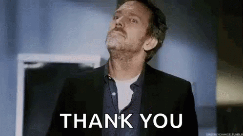 Man in Suit Giving Thank You Gesture