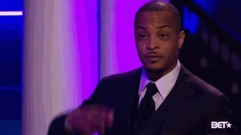 Man in Suit Giving Thumbs Up