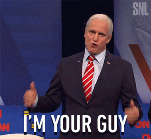 Man in Suit Giving Thumbs Up Saying I'm Your Guy