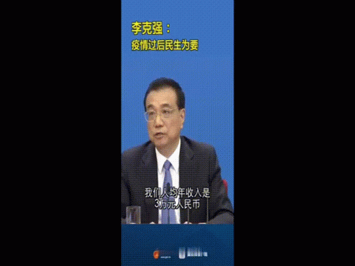 Man in Suit Giving Thumbs Up