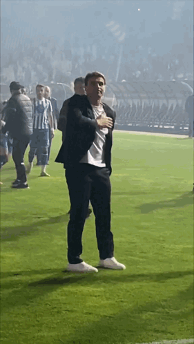 Man In Suit Hands On Chest GIF