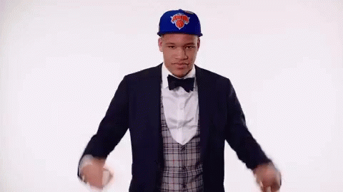 Man in Suit Hat and Bow Tie Dancing