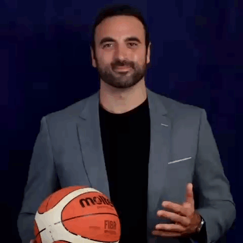 Man In Suit Holding Basketball GIF