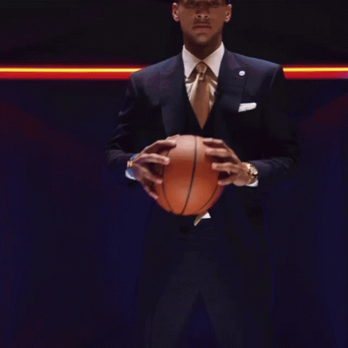 Man in Suit Holding Basketball