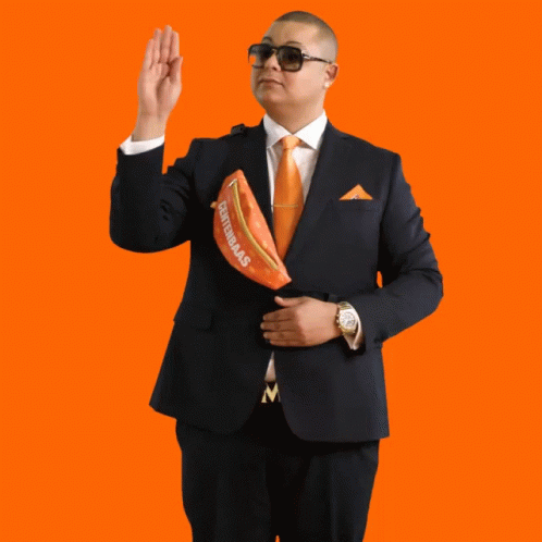 Man in Suit Holding Centennials Fanny Pack