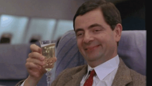 Man In Suit Holding Champagne GIF