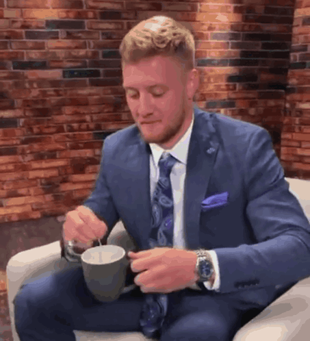 Man In Suit Holding Coffee GIF