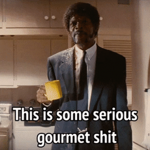 Man in Suit Holding Coffee Saying Serious Gourmet