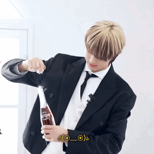 Man in Suit Holding Coke