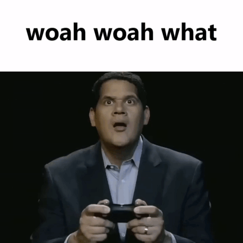 Man in Suit Holding Controller Saying Woah Woah What