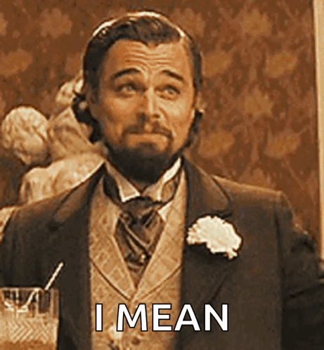 Man in Suit Holding Glass Straw I Mean