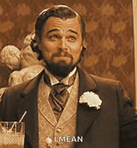 Man in Suit Holding Glass