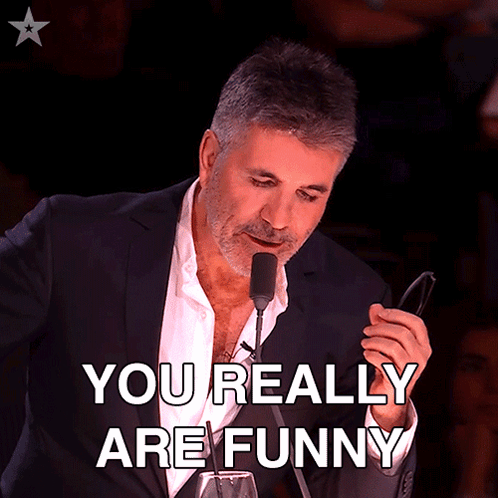 Man in Suit Holding Glasses Says You Really Are Funny