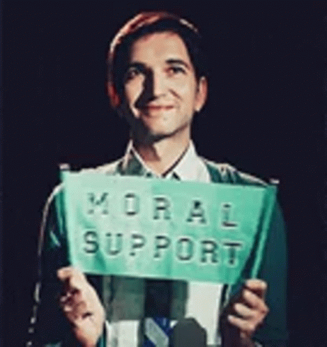 Man in Suit Holding Green Sign Moral Support