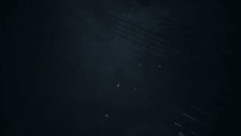 Man In Suit Holding Gun GIF
