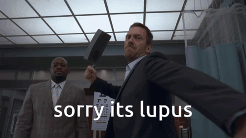 Man in Suit Holding Hammer Sorry Its Lupus