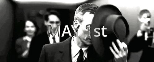 Man In Suit Holding Hat GIF