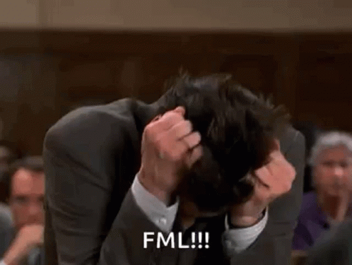 Man In Suit Holding Head Saying FML GIF