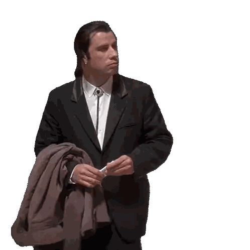 Man in Suit Holding Jacket and Phone